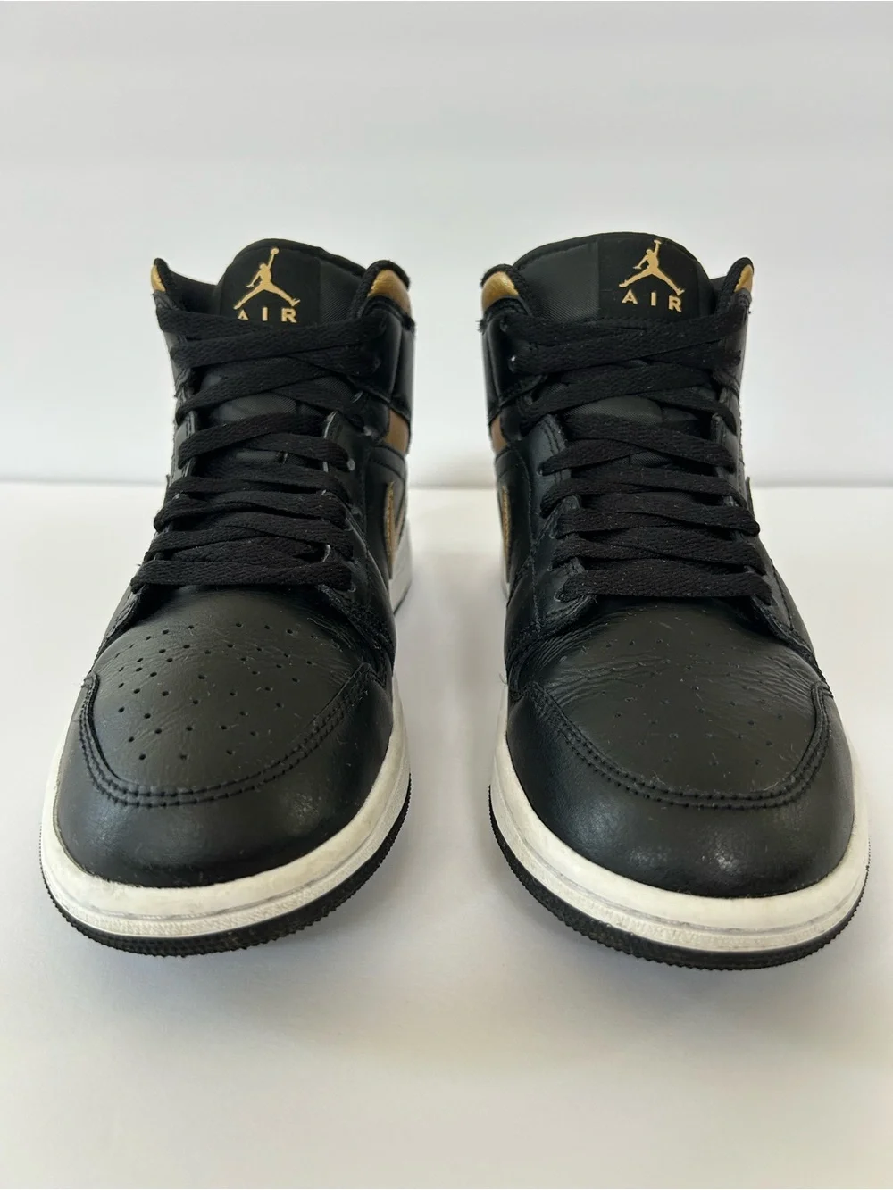 Air Jordan Black and Gold High-Top Sneakers